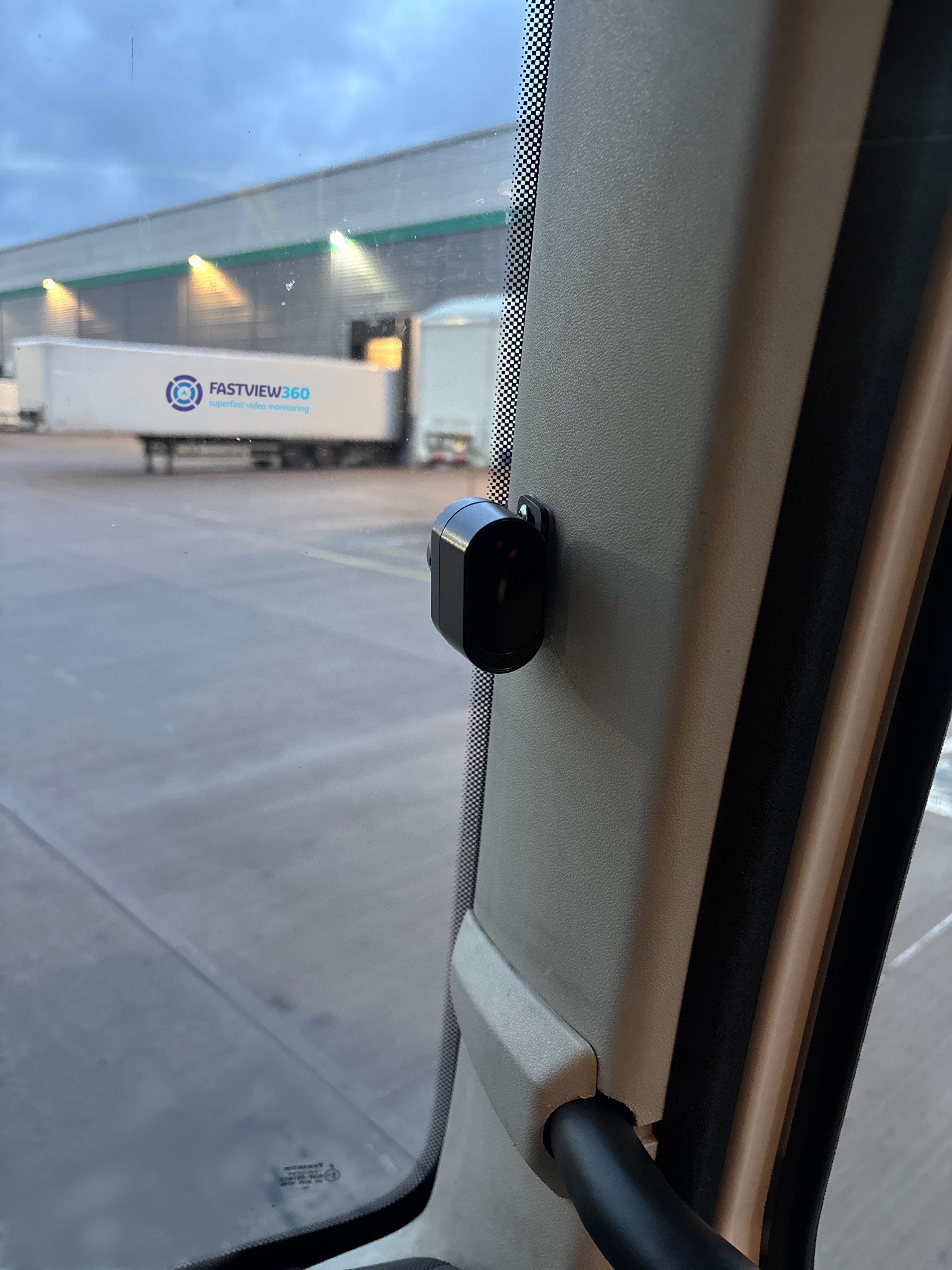 Driver Monitoring System camera installed on the A-pillar of a commercial vehicle cab